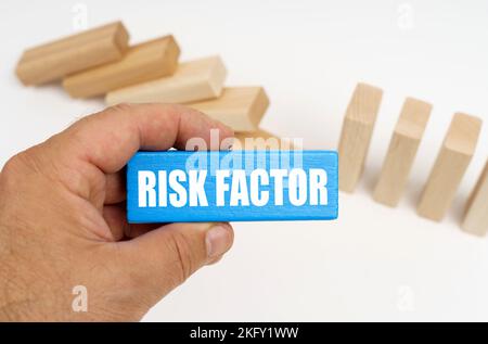 Medicine and health concept. In the background there are wooden planks - half are standing, half are lying. In the hands of a blue plaque with the ins Stock Photo