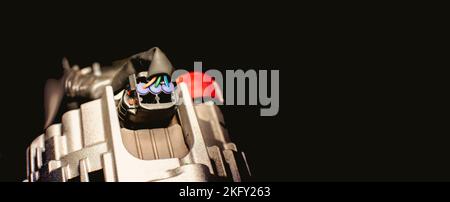 Electric plug wire connected to alternator with three wires type of the vehicle electric system Stock Photo