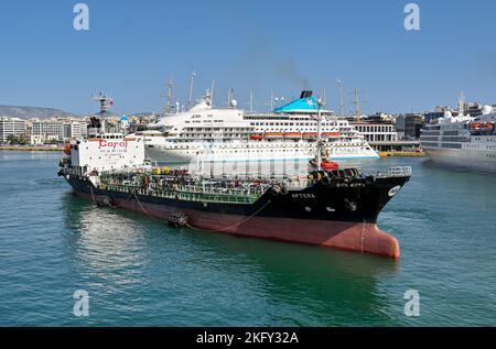 Piraeus, Athens, Greece - June 2022: Small oil tanker vessel used for refuelling larger ships in the port of Piraeus. Stock Photo