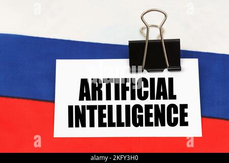 National concept. On the flag of Russia there is a business card with the inscription - artificial intelligence Stock Photo