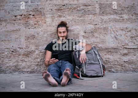 Barefoot man stretched out on lawn, Humlegården, Stockholm, Sweden Stock  Photo - Alamy