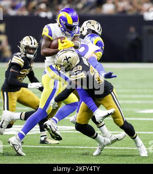 New Orleans, USA. 20th Nov, 2022. New Orleans Saints cornerback Paulson Adebo (29) tackles Los Angeles Rams wide receiver Brandon Powell (19) during a National Football League contest at Caesars Superdome in New Orleans, Louisiana on Sunday, November 20, 2022. (Photo by Peter G. Forest/Sipa USA) Credit: Sipa USA/Alamy Live News Stock Photo