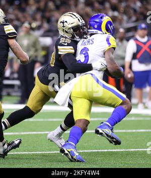 New Orleans, USA. 20th Nov, 2022. New Orleans Saints cornerback Paulson Adebo (29) tackles Los Angeles Rams running back Cam Akers (3) during a National Football League contest at Caesars Superdome in New Orleans, Louisiana on Sunday, November 20, 2022. (Photo by Peter G. Forest/Sipa USA) Credit: Sipa USA/Alamy Live News Stock Photo