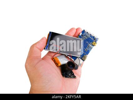 Electronics hazardous waste in a hand on white background Stock Photo