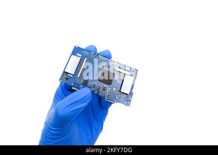 Electronics circuit board in a technician hand on white background Stock Photo