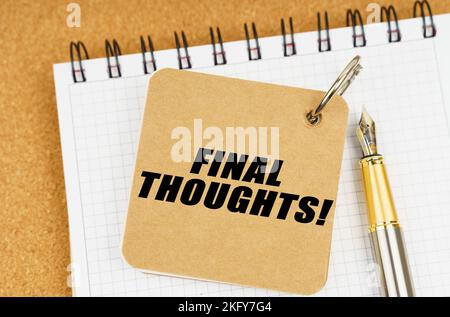 Business and economy concept. There are two notebooks and a pen on the table. On the top notepad, the inscription - Final Thoughts Stock Photo