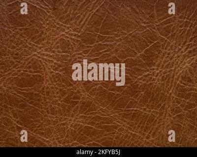 Genuine soft brown leather skin natural with design lines pattern or red abstract background. Genuine leather texture. Use wallpaper or backdrop Stock Photo