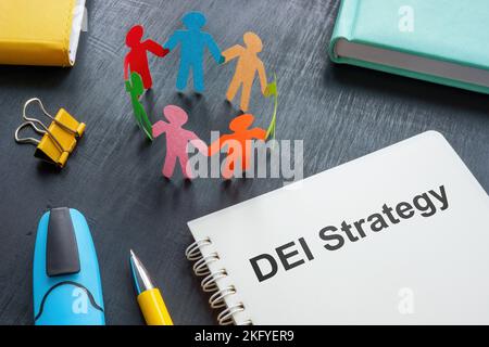 DEI strategy plan and notepads on the desk. Stock Photo