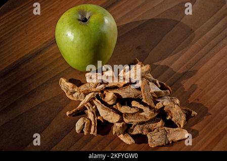 Dried apple slices in morning sun. Called schnitz or snitz they originated with the Amish in PA in the early 19th century. Stock Photo