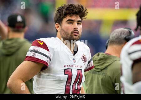 Washington Commanders quarterback Sam Howell (14) warms up prior to the  start of an NFL pre-season football game against the Cleveland Browns,  Friday, Aug. 11, 2023, in Cleveland. (AP Photo/Kirk Irwin Stock