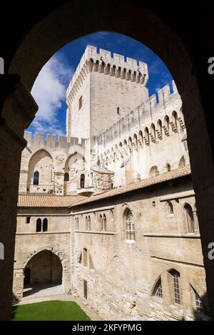 Cloister and Campane tower through silhouetted arch, Palace of the Popes, Avignon, Provence, France. Stock Photo