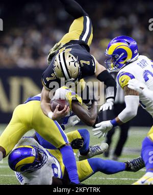 New Orleans, United States. 21st Nov, 2022. New Orleans Saints tight end Taysom Hill (7) leaps over Los Angeles Rams defenders at the Caesars Superdome in New Orleans on Sunday, November 20, 2022. Photo by AJ Sisco/UPI. Credit: UPI/Alamy Live News Stock Photo