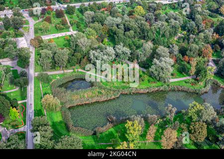 City park and lake with from above . Aerial view of green public park Stock Photo