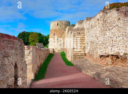 The old stone Izborskaya fortress. Defensive corridor at the fortress walls, an architectural monument of the XIV-XVII century. Izborsk, Pskov region, Stock Photo