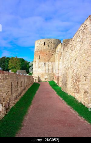 The old stone Izborskaya fortress. Defensive corridor at the fortress walls, an architectural monument of the XIV-XVII century. Izborsk, Pskov region, Stock Photo