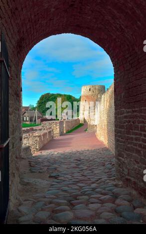 The old stone Izborskaya fortress. The entrance gate at the defensive corridor, an architectural monument of the XIV-XVII century. Izborsk, Pskov regi Stock Photo