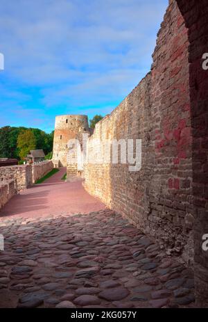 The old stone Izborskaya fortress. Defensive corridor at the fortress walls, an architectural monument of the XIV-XVII century. Izborsk, Pskov region, Stock Photo