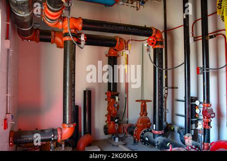 Pipes crisscross a fire pump room inside the Central Utility Plant in Stockton, California, which supports the much larger VA Community Based Outpatient Clinic and, eventually, the Community Living Center. Crews have been building the CUP since late 2019 and have made significant progress on installing the building’s utility support systems. The CUP and CBOC are scheduled for completion in 2023. Community-Based Outpatient Clinic,Department of Veterans Affairs,U.S. Army Corps of Engineers,USACE,VA, Stock Photo