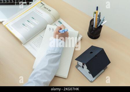 studying at home, study desk setup real estate agent license test Stock Photo