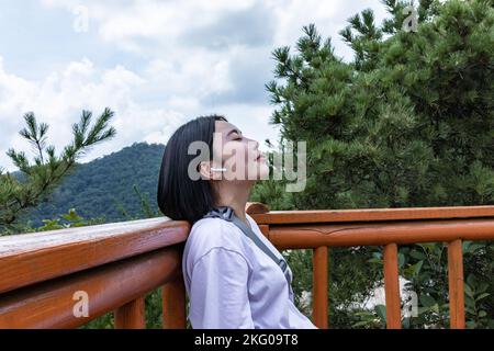 korean young women hiking and plogging resting Stock Photo