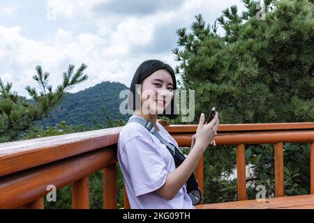 korean young women hiking and plogging resting Stock Photo