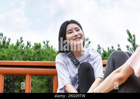 korean young women hiking and plogging resting Stock Photo