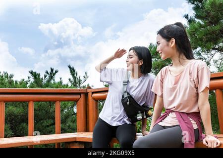 korean young women hiking and plogging resting Stock Photo