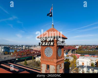 Union Station passenger railway station with sign on tower saying 'Go By Train' and 'Union Station'. Stock Photo