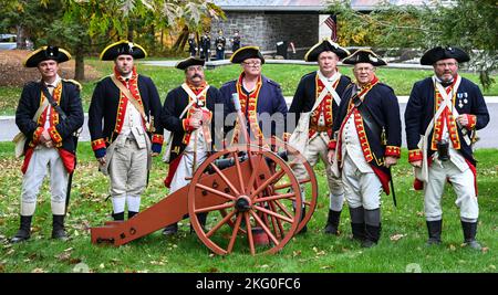 Members of the Saratoga Battle Chapter of the Sons of the Revolution pose for a photo, with their cannon, prior to the dedication of a memorial stone for Private Oliver Barrett at the Saratoga National Cemetery on October 19, 2022.  Barrett volunteered as a Minuteman and died serving under the 10th Massachusetts Regiment in the Battle of Saratoga on October 7, 1777, at 51 years of age. Barrett lies in an unmarked grave on the Saratoga Battlefield and was honored with a memorial stone at the ceremony. Stock Photo