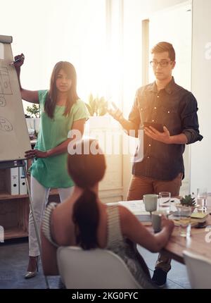 Bright minds at work. a group of coworkers in a boardroom meeting. Stock Photo