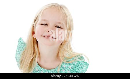 I see you up there. Studio shot of a cute little girl in a frilly dress against a white background. Stock Photo