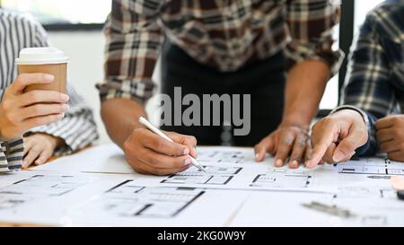Team of professional Asian engineer and architect are working together in the office, brainstorming and discussing on their project. cropped and close Stock Photo
