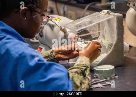 Students fabricate dental appliances during classes at the Medical Education and Training Center (METC), Joint Base San Antonio-Fort Sam Houston, Texas, October 20, 2022. The METC on Joint Base San Antonio-Fort Sam Houston, Texas, trains enlisted medical professionals in the Army, Navy, Air Force, and Coast Guard. One of METC’s 48 programs of instruction is the multi-service Dental Laboratory Technology program in which Army, Navy, and Air Force students learn how to fabricate complete dentures, Removable Partial Dentures (RPD) and treatment appliances, crowns and bridges, metal-ceramic restor Stock Photo