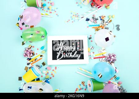 Carnival, festival or birthday holiday balloons blue background. Top view, flat lay Stock Photo