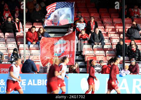 A Liverpool fans fly flags and banners in the stands during Barclays Women's Super League match between Brighton and Albion Hove Women against Liverpo Stock Photo