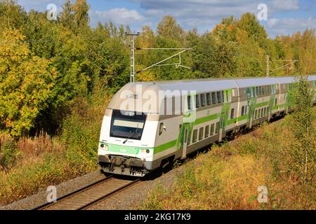 VR Group Intercity fast train at speed on a sunny day of autumn, elevated view from bridge. Salo, Finland. September 27, 2020. Stock Photo