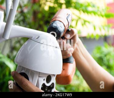 Man installing IP CCTV or high tech surveillance system CCTV system Stock Photo