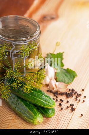 Gherkins. Pickles. Salted Cucumbers still-life on wooden background Stock Photo