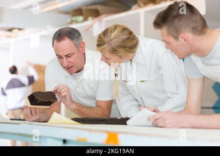 young apprentices learning to paint Stock Photo