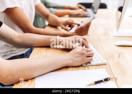 close up. a group of employees use devices in the office Stock Photo
