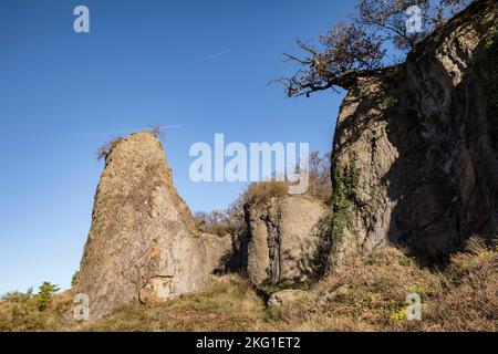 rock pillar of the Stenzelberg mountain in the Siebengebirge hill range near Koenigswinter, the mountain served as a quarry for quartz latite until th Stock Photo