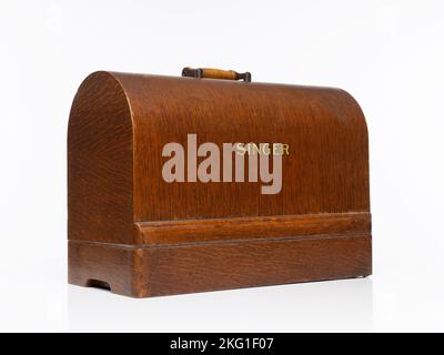 Isolated vintage wooden carry case for a Singer 99k Sewing Machine Stock Photo