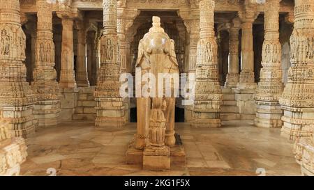 Sculpture of elephant  and man and intricately carved pillars, Ranakpur Jain Temple, Rajasthan, India. Temple has 1444 pillars individually carved and Stock Photo