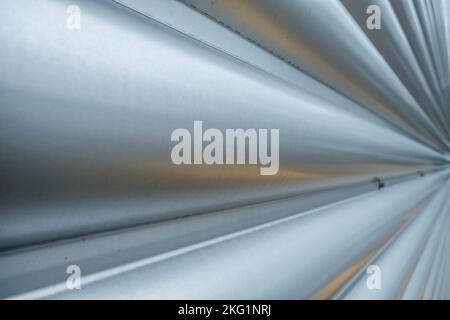 Epsom, Surrey, London UK, November 19 2022, Close Up Abstract Image Of Modern Steel Or Metal Security Door Showing Lines And Patterns With No People Stock Photo