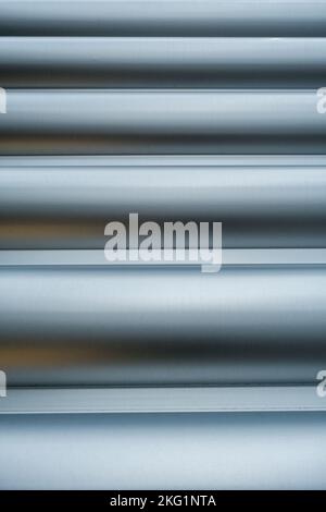 Epsom, Surrey, London UK, November 19 2022, Close Up Abstract Image Of Modern Steel Or Metal Security Door Showing Lines And Patterns With No People Stock Photo