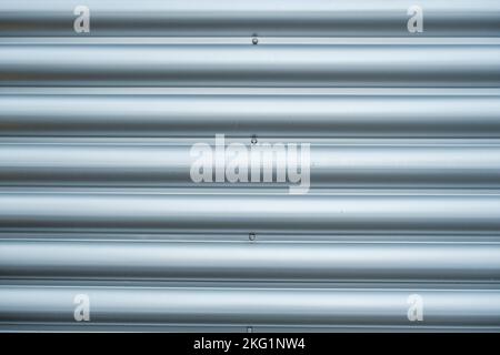 Epsom, Surrey, London UK, November 19 2022, Close Up Abstract Image Of Modern Steel Or Metal Security Door Showing Lines And Patterns With No People Stock Photo