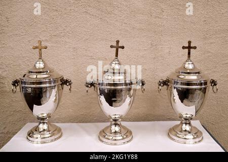 Holy Thursday. Chrism Mass. Holy oils used in the sacraments. Sacred Chrism, the Oil of the Sick and the Oil of Catechumens. France. Stock Photo