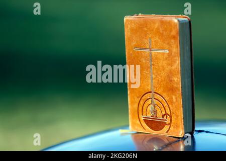 Old bible brown leather cover with cross. Stock Photo