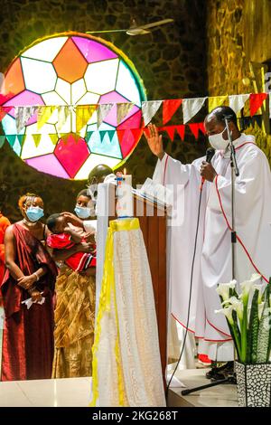 Sunday mass with baptisms in Karongi Genocide Memorial church, Kibuye, western Rwanda. Stock Photo