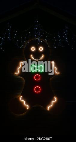 Street Christmas, New Year decoration made of led lamps in the form of gingerbread man. Close-up, in the evening night, outside Stock Photo